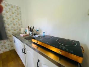 a kitchen with a sink and a stove at Sabai Homes 3 in Mae Haad +12 photos