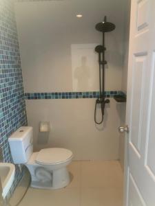 a bathroom with a toilet and a sink at Nai Yang Guest House in Nai Yang Beach