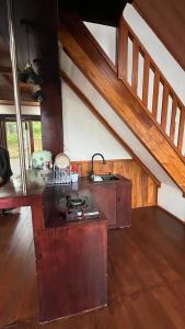 a kitchen with a sink and a counter top at Padangsari Cabin House in Diyeng +15 photos