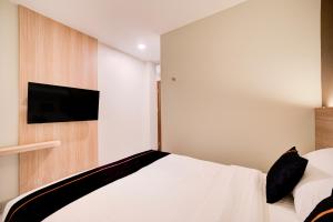 Et tv og/eller underholdning på Townhouse Oak Cengkareng + 19 billeder