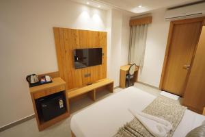 a room with a bed and a tv in a room at Hotel Northern Heights in Amritsar