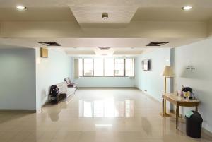 a living room with a couch and a table at Wish Inn Chidlom - Ratchadamri 2 in Pratunam