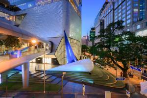 a view of a building with a whale sculpture at Wish Inn Chidlom - Ratchadamri 2 in Pratunam
