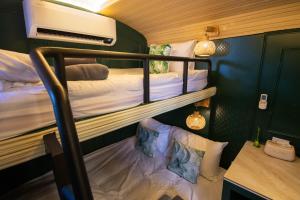a small room with two bunk beds in it at Baan Rot Fai Krabi Platform 2 in Ao Nam Mao +91 photos