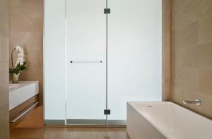 a bathroom with a tub and a sink at The Ritz-Carlton, Herzliya in Herzliya