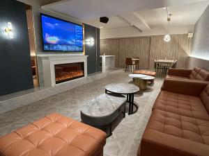 a living room with a couch and a fireplace at HINOEN Hotel in Taipei