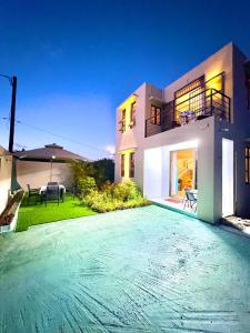 a house with a large driveway in front of it at Salmaan Villa in Grand-Baie