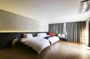 Postel nebo postele na pokoji v ubytování Daesungkwan Hot Spring Hotel