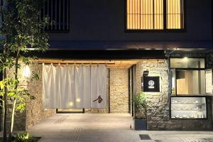 a white curtain in front of a building at soyo-ka kyoto sanjo in Kyoto
