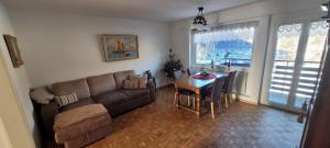 a living room with a couch and a table at Ferienwohnung Stützen in Brig
