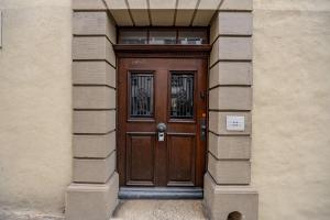 a wooden door in the side of a building at The R Apartment Cholfirst in Schaffhausen