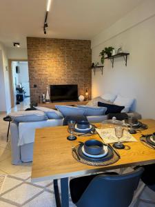 a living room with a table and a couch at addview 2 in Nafplio