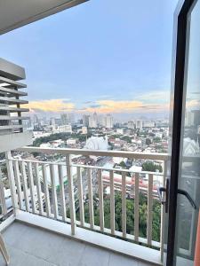 a balcony with a view of a city at NM 1BR Condo with Balcony at Horizons 101 in Cebu City