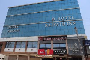 a building with a sign on the side of it at HOTEL RAJPATH Inn in Mahesāna