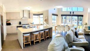 a kitchen and living room with a large island in a room at Large Five Bdrm Home Near Beach in Apollo Bay