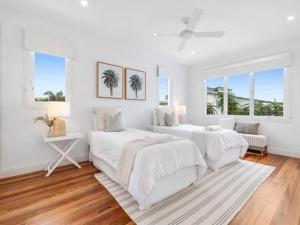 a white bedroom with two beds and a window at Coastal Luxe - Hampton inspired in Kingscliff +100 photos