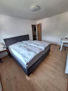 a bedroom with a large bed in a room at Ferienwohnung Karin in Schwaz