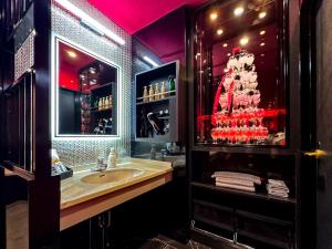 a bathroom with a sink and a mirror at Fire Hotel Nw in Saitama