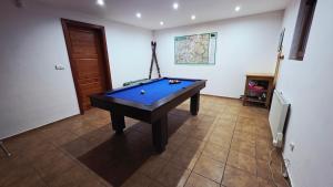 a room with a pool table in a room at Chata pod Kykulou in Oščadnica