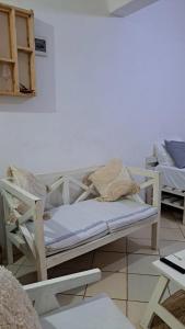 a room with two beds sitting next to a wall at Kwetuh in Kwale