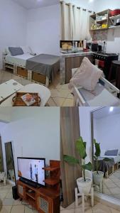a living room with a bed and a television at Kwetuh in Kwale