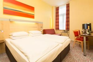 Cama o camas de una habitación en Exe City Park Hotel