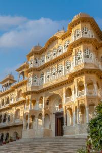 a large building with a staircase in front of it at Abheygarh in Khetri +20 photos