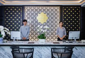 two men standing in front of a table with chairs at Narinthra Heritage in Chiang Mai +49 photos