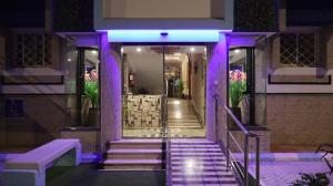 a stairway with purple lights in a building at إقامة البندر 1 - Al Bandar 1 Apartments Managed by Yanbu Suites in Yanbu