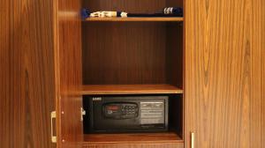 a wooden cabinet with a microwave oven in it at إقامة البندر 1 - Al Bandar 1 Apartments Managed by Yanbu Suites in Yanbu