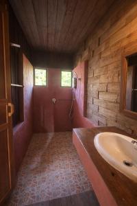 a bathroom with a tub and a sink at nam jai pai in Ban Wiang Nua +38 photos