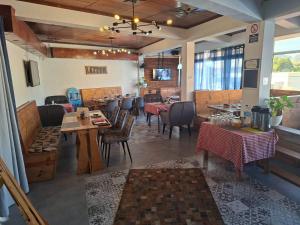 a dining room with tables and chairs in a restaurant at Hello Tourist Residence in Quatre Bornes