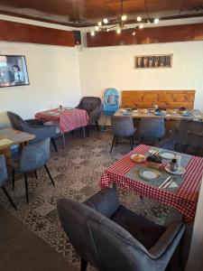 a restaurant with tables and chairs in a room at Hello Tourist Residence in Quatre Bornes