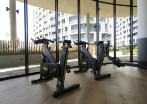a row of cardio treadmills in a gym at Ellipse Luxurious Tamarind Red Studio Experience in Midrand