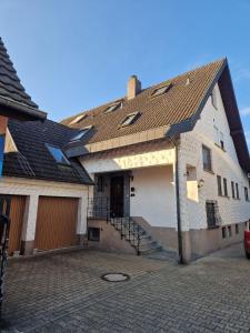 a house with a garage and a roof at Huus 17 in Rust