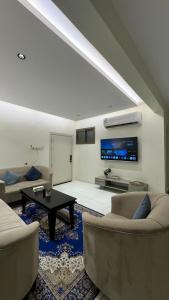 Et opholdsområde på شقة سويس بدخول ذاتي