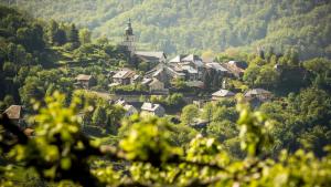 a small village in the mountains with a church at Cocon sous les toits in Albertville
