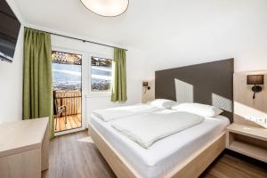 En eller flere senge i et værelse på Glücksmoment Götschlhof + 34 billeder