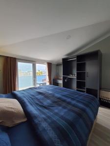 a bedroom with a large bed with a large window at Golden Moon Hotel in Fethiye +56 photos