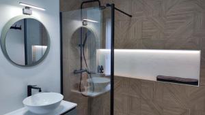 a bathroom with a shower and a sink and a mirror at La Cantizada in Viloria +32 photos
