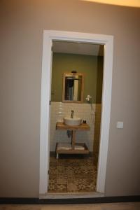 a bathroom with a sink and a mirror at Zoom Airport Hotels in Istanbul