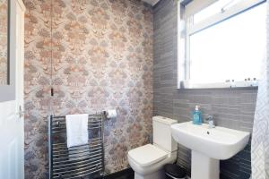 a bathroom with a toilet and a sink at Stylish 3BR House - Sleeps 5 - Free Parking in Ferryhill +20 photos