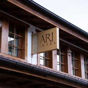 an art hotel sign on the side of a building at Hotel Ari Old Town in Gjakove