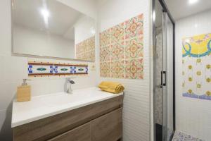 a bathroom with a sink and a shower at The Tile House in Güéjar-Sierra +16 photos