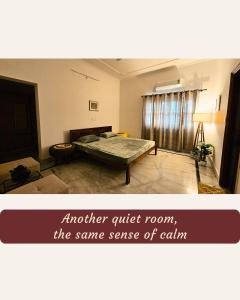 a bedroom with a bed in the middle of a room at Ashiana By Ijabojyu- Pet friendly Homestay in Dehradun
