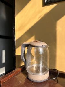 a blender sitting on top of a wooden table at Sunny Side Up top-floor apartment in Kathmandu