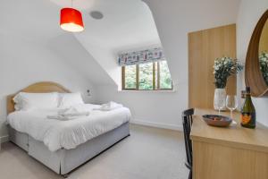 a bedroom with a bed and a table with wine glasses at 7 Bed in Ashton oc-p00891 in Germoe +47 photos