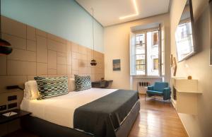 Postel nebo postele na pokoji v ubytování Hotel Milu Florence