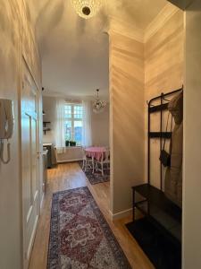a hallway with a room with a table and a dining room at Villa Thurdus in Härnösand