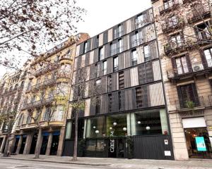 a building on a street in front of a building at Casp 74 Apartments in Barcelona